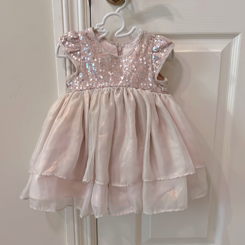 12 month special occasions cream peach dress with multiple layers and sequins.